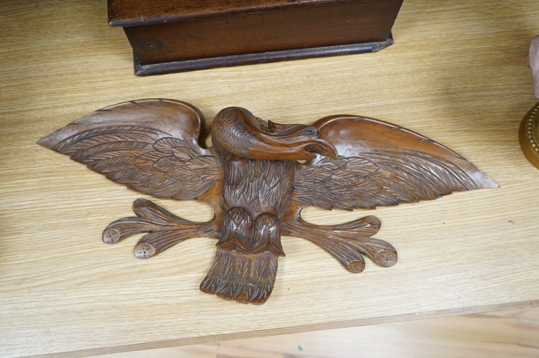 A mahogany leather-handled tool box and carved American eagle wall mount, largest 66cm wide